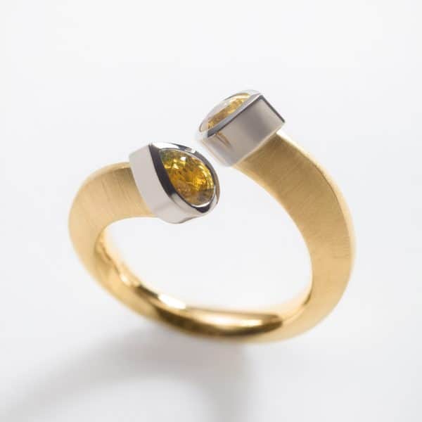 18ct-Yellow-Gold-split-ring-set-with-2-x-pear-cut-yellow-sapphires-in-White-Gold-settings