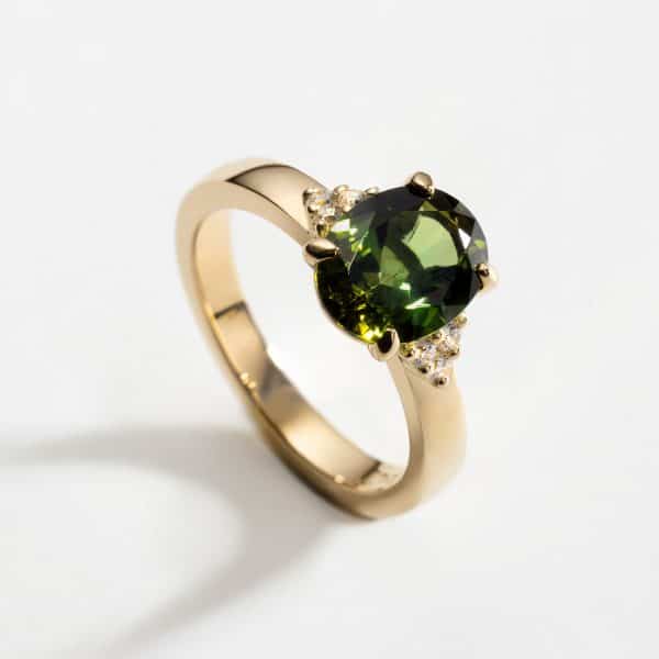 18ct Yellow Gold Ring, Oval (9 x 7mm) 1.78ct Green Tourmaline and 6 x 1.5mm round brilliant diamonds in claw setting.