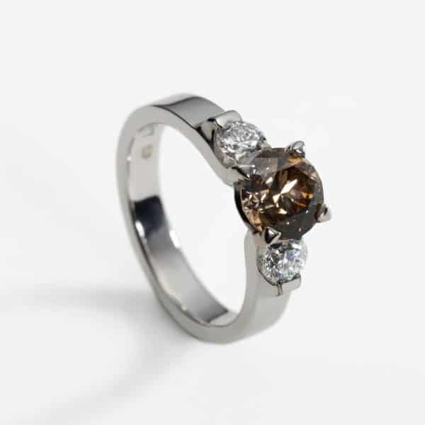 18ct white gold three stone ring with cognac diamond and two white diamonds