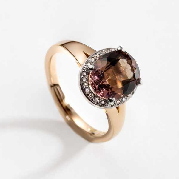 18ct rose gold ring with pink tourmaline in diamond halo