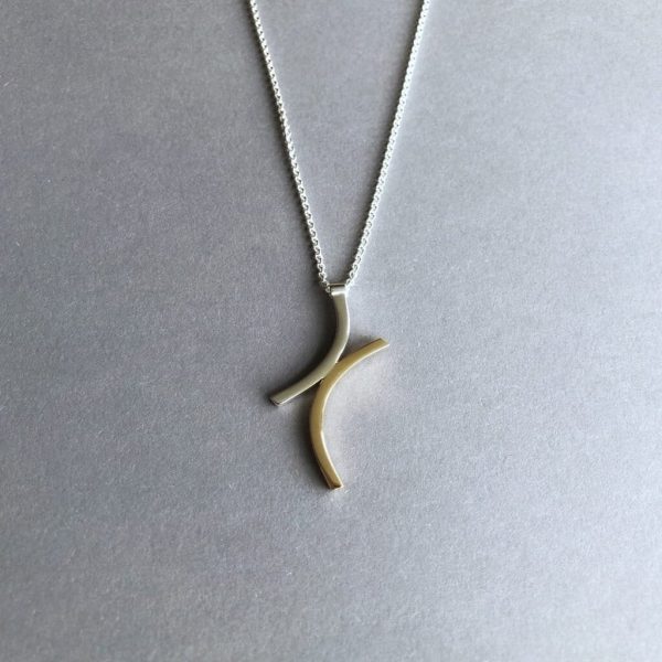 Janus 9ct yellow gold and silver pendant