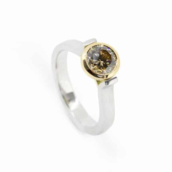Sherkin platinum and 18ct yg engagement ring, 1.03ct round brilliant champagne diamond
