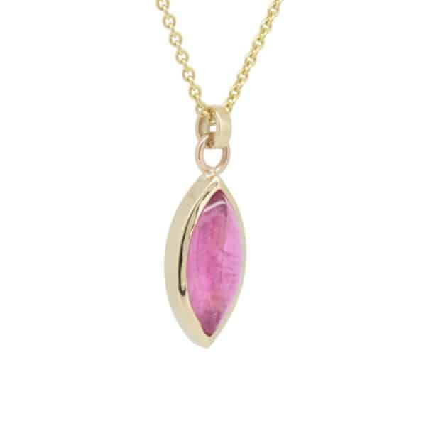 9ct yellow gold pendant with 14 x 7mm pink marquise tourmaline in a rubover setting. 9ct yellow gold chain