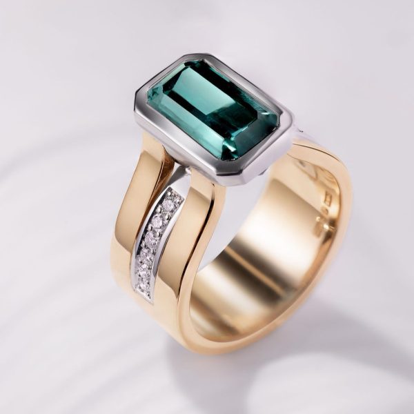 9mm 18ct yellow gold band platinum inlay and setting 4ct octagonal indigolite and pave diamonds under setting and shoulders €12,850