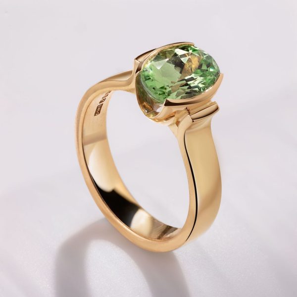 18ct yellow gold signature Demi Fush ring set with a 2.10ct oval Tsavorite, €6,250
